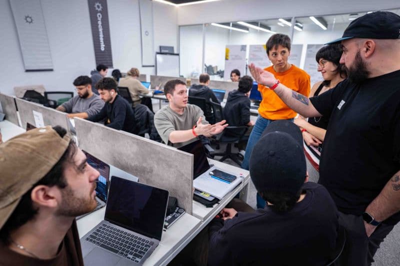 Franco Ferreira and the Vueltito team working during the hackathon